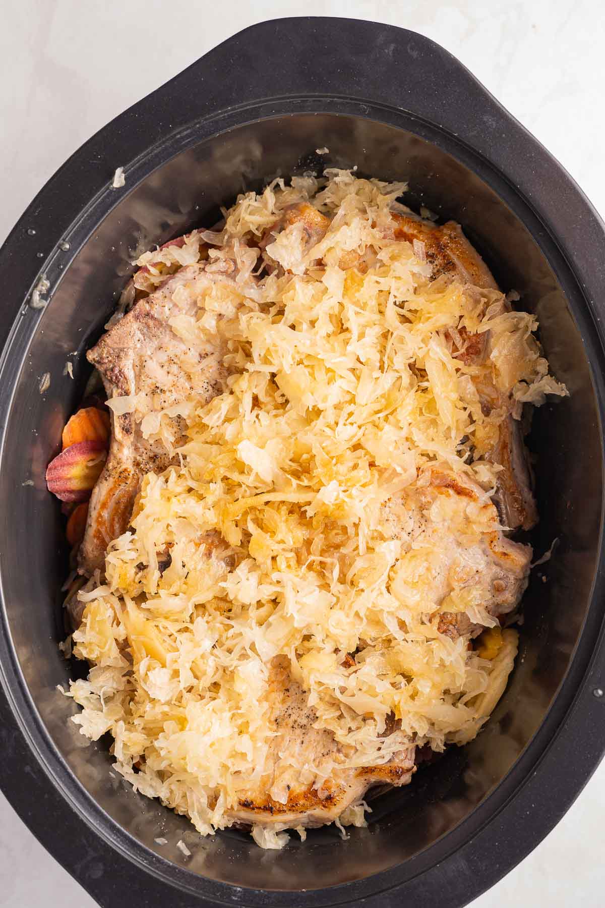 Simple Slow Cooker Pork Chops in Sauerkraut for a Weeknight Meal